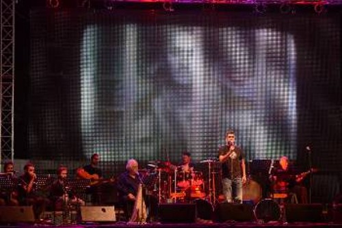 Το 2013 στην Κεντρική Σκηνή του Φεστιβάλ, σε μουσικοθεατρικό αφιέρωμα για τα 45 χρόνια της ΚΝΕ