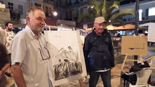Τ. Βαρελάς και Ι. Ερτέλ μπροστά από έργο που συνυπογράφουν