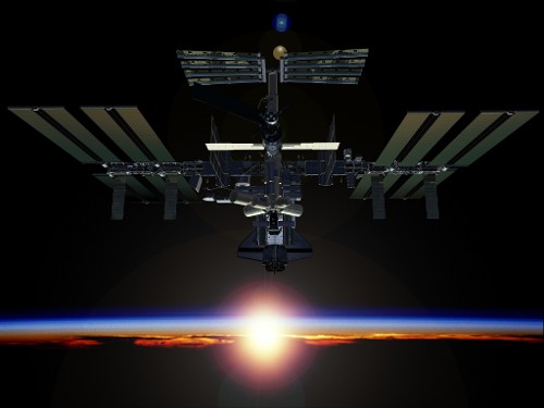 Εντυπωσιακή ανατολή από το Διεθνή Διαστημικό Σταθμό (καλλιτεχνική απεικόνιση του σταθμού σε πλήρη ανάπτυξη)
