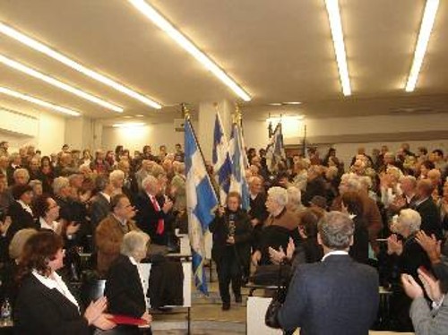 Κατάμεστη η αίθουσα του Πανεπιστημίου Μακεδονία στην εκδήλωση για τα 90χρονα της Οχτωβριανής Επανάστασης, για την απελευθέρωση της Θεσσαλονίκης και την ίδρυση του ΕΑΜ
