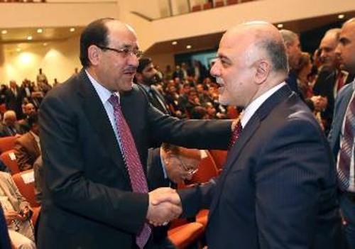 Χειραψία Αλ Μάλικι και Αλ Αμπαντί, που σηματοδοτεί την προσπάθεια ενδοαστικού συμβιβασμού