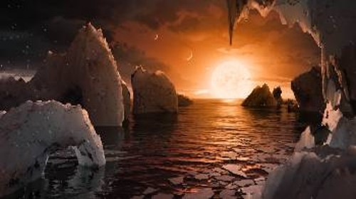 Καλλιτεχνική απεικόνιση της θέας από τον TRAPPIST-1f, με το νερό - εφόσον υπάρχει - να κυριαρχεί, τόσο σε υγρή όσο και σε παγωμένη μορφή, κοντά στον τερματικό μεσημβρινό, που χωρίζει την πλευρά που έχει συνεχώς μέρα από εκείνη που έχει συνεχώς νύχτα. Στο βάθος του ορίζοντα το αστέρι του πλανητικού συστήματος. Στον ουρανό φαίνονται 3 από τους άλλους πλανήτες (δύο κοντά και ένας στο βάθος). Επειδή δεν απέχουν πολύ από τον TRAPPIST-1f, κάποιοι έχουν φαινόμενη διάμετρο μεγαλύτερη από της Σελήνης!